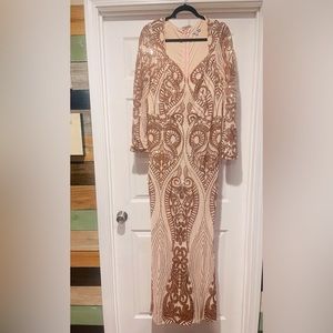 Elegant floor length long sleeve dress. Never worn.